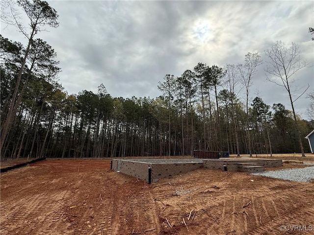 59 Jamestown Ln, Bracey, VA 23919 - view of yard featuring a view of trees