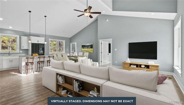 59 Jamestown Ln, Bracey, VA 23919 - living area with recessed lighting, light wood-style flooring, baseboards, high vaulted ceiling, and a ceiling fan