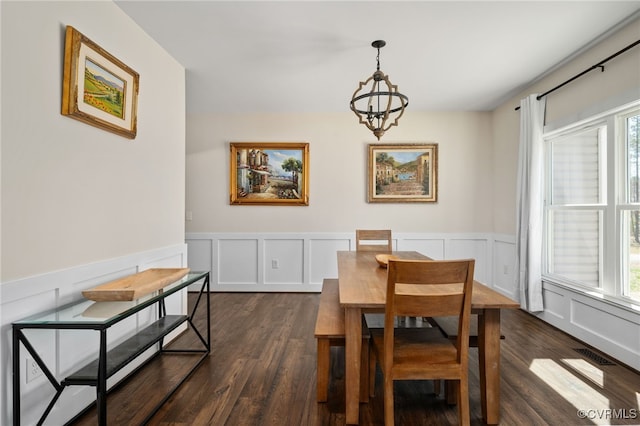 13201 Brooke Ridge Ln, Spotsylvania, VA 22551 - dining space featuring a chandelier, dark wood finished floors, a wainscoted wall, and a decorative wall