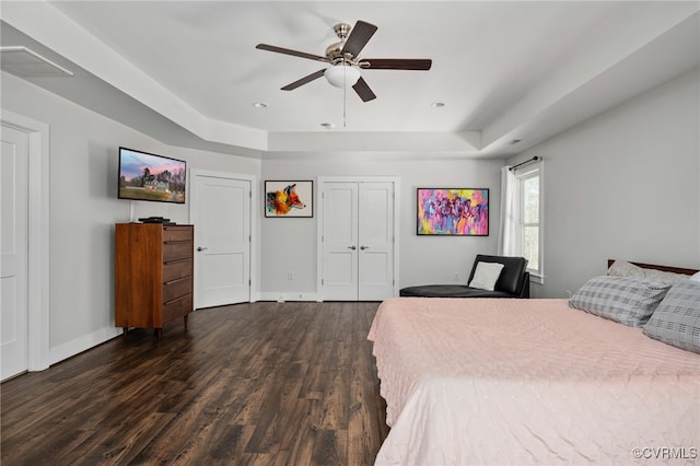 13201 Brooke Ridge Ln, Spotsylvania, VA 22551 - bedroom featuring a tray ceiling, dark wood-style floors, ceiling fan, and a closet
