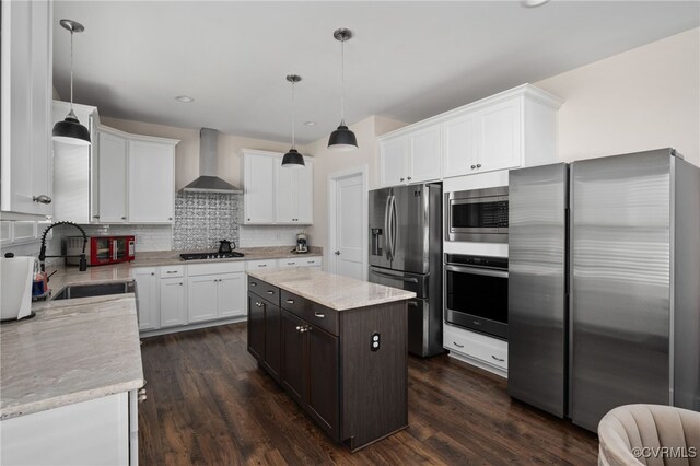 13201 Brooke Ridge Ln, Spotsylvania, VA 22551 - kitchen with stainless steel appliances, wall chimney range hood, white cabinets, tasteful backsplash, and recessed lighting
