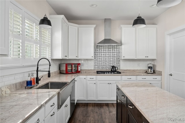 13201 Brooke Ridge Ln, Spotsylvania, VA 22551 - kitchen with wall chimney exhaust hood, white cabinets, dark wood finished floors, decorative backsplash, and decorative light fixtures