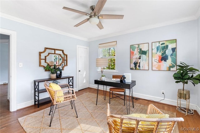 office area with baseboards, a ceiling fan, crown molding, and wood finished floors