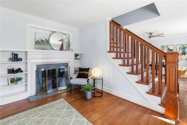 interior space featuring ornamental molding and wood finished floors