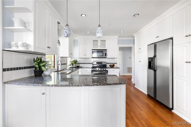 kitchen with open shelves, a sink, a peninsula, white cabinetry, and stainless steel appliances