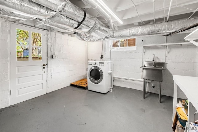 below grade area featuring washer / dryer