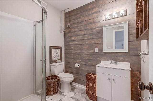 bathroom with visible vents, vanity, a shower stall, and toilet