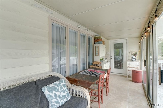 sunroom with tile patterned floors