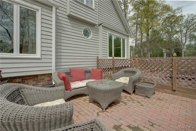 view of patio / terrace featuring fence