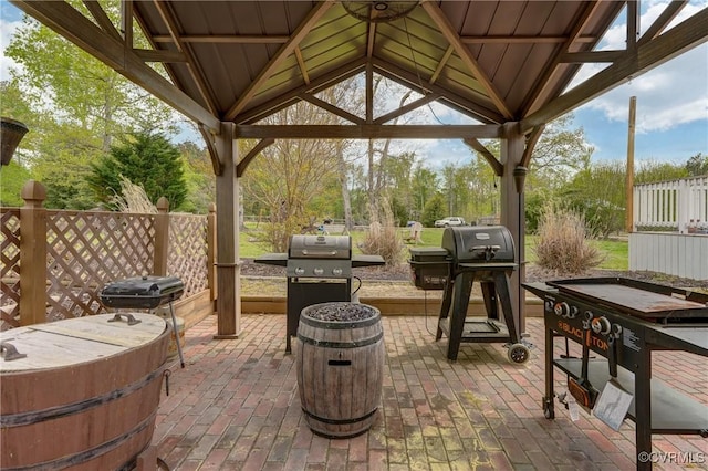 view of patio / terrace featuring a gazebo, an outdoor fire pit, and a grill