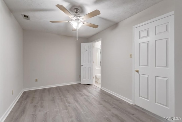 12255 Shore View Dr, Henrico, VA 23233 - unfurnished bedroom with wood finished floors, ensuite bathroom, and a ceiling fan