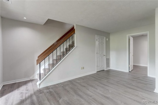 12255 Shore View Dr, Henrico, VA 23233 - unfurnished living room featuring wood finished floors, stairs, and recessed lighting