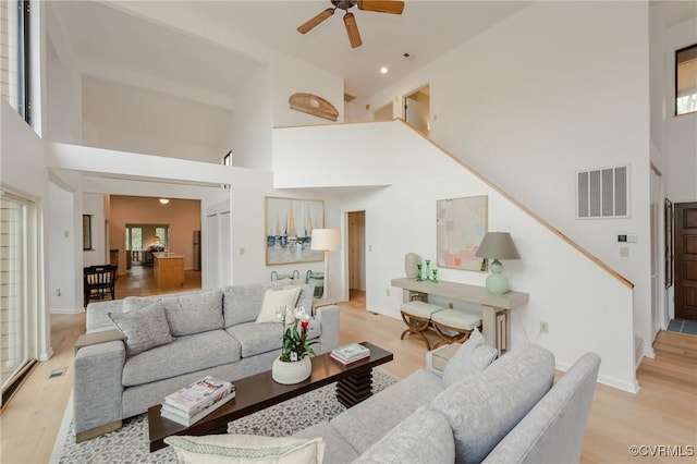 941 Wilton Coves Dr, Hartfield, VA 23071 - living room featuring light wood-style flooring, a high ceiling, ceiling fan, recessed lighting, and baseboards