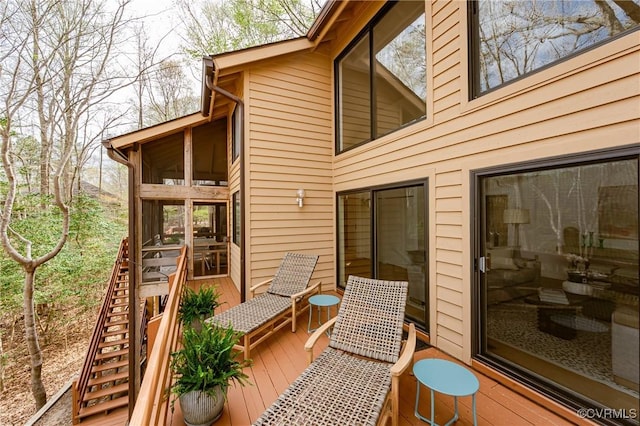 941 Wilton Coves Dr, Hartfield, VA 23071 - wooden deck featuring stairway and a sunroom