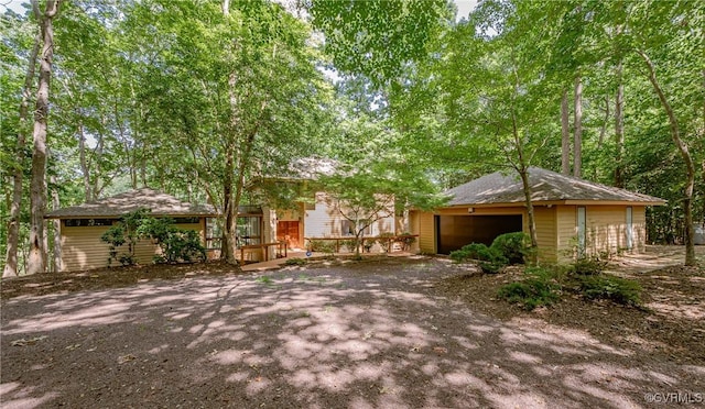 941 Wilton Coves Dr, Hartfield, VA 23071 - view of front of property with a garage and an outbuilding