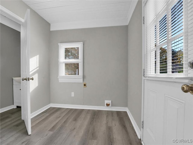 interior space with baseboards and wood finished floors