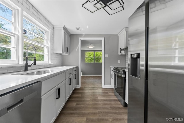 14008 Tyus Rd, Sussex, VA 23882 - kitchen with light countertops, a sink, appliances with stainless steel finishes, and dark wood finished floors