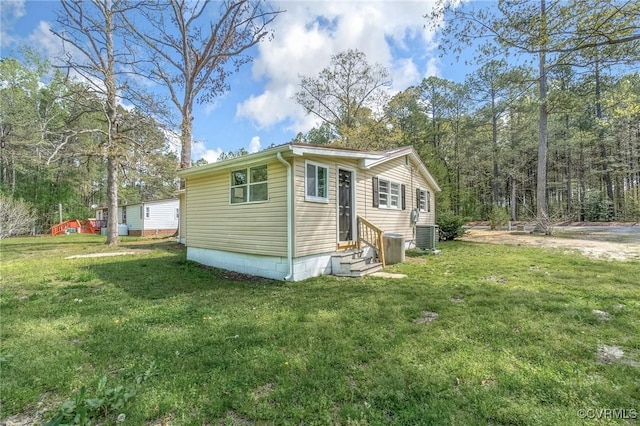 14008 Tyus Rd, Sussex, VA 23882 - view of property exterior with a yard, cooling unit, and entry steps