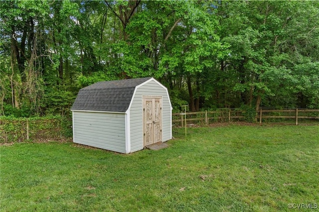 view of shed with fence