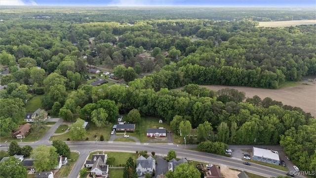 aerial view featuring a wooded view