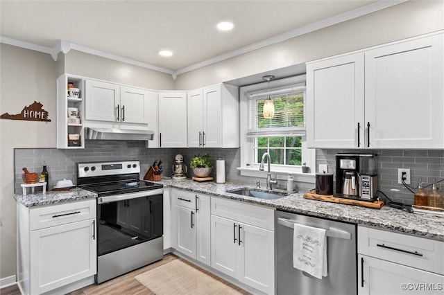 kitchen with a sink, white cabinetry, appliances with stainless steel finishes, and under cabinet range hood