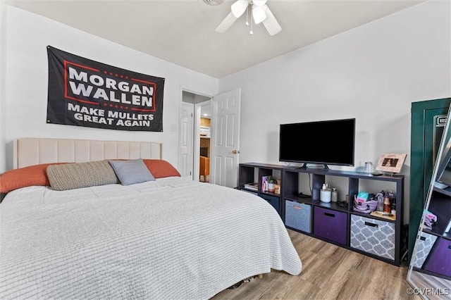 bedroom with a ceiling fan and wood finished floors