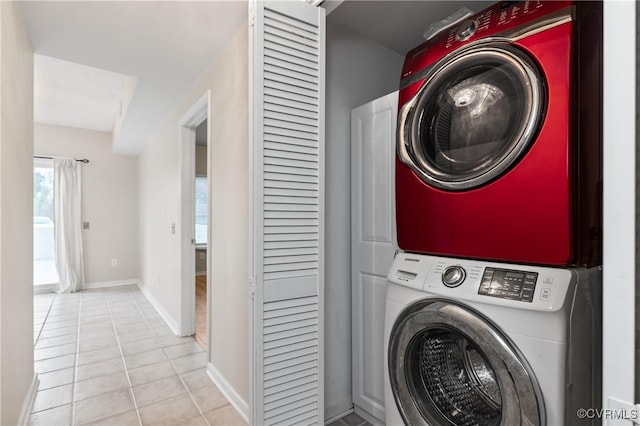 301 Beacon Ridge Dr Unit 109, Hopewell, VA 23860 - laundry room featuring stacked washer and clothes dryer and tile patterned floors