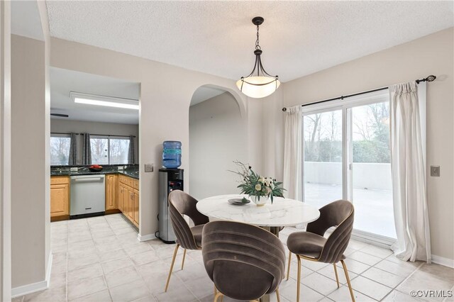 301 Beacon Ridge Dr Unit 109, Hopewell, VA 23860 - dining room with arched walkways and a textured ceiling