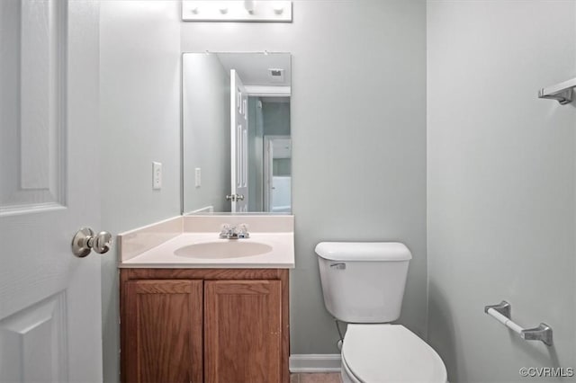 2567 Exhall Ct, Chester, VA 23831 - half bath featuring toilet, vanity, and baseboards