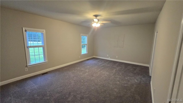 454 W Spring Forest Rd, King William, VA 23086 - spare room featuring dark colored carpet, baseboards, a ceiling fan, and a healthy amount of sunlight