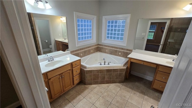 454 W Spring Forest Rd, King William, VA 23086 - bathroom featuring toilet, a jetted tub, a stall shower, a sink, and tile patterned floors