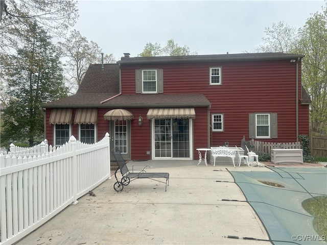 2611 Mistwood Forest Dr, Chester, VA 23831 - back of house featuring a patio, a shingled roof, fence, and a covered pool