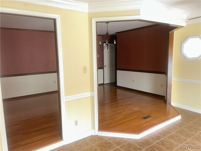 2611 Mistwood Forest Dr, Chester, VA 23831 - tiled empty room with wallpapered walls, visible vents, baseboards, and crown molding