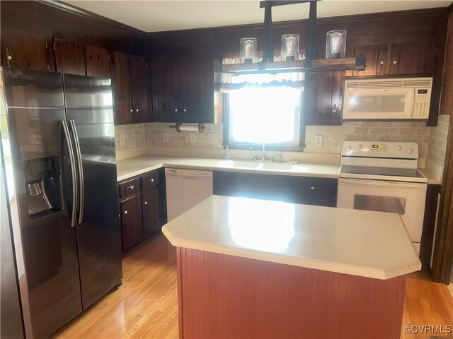 2611 Mistwood Forest Dr, Chester, VA 23831 - kitchen featuring a sink, light countertops, and white appliances