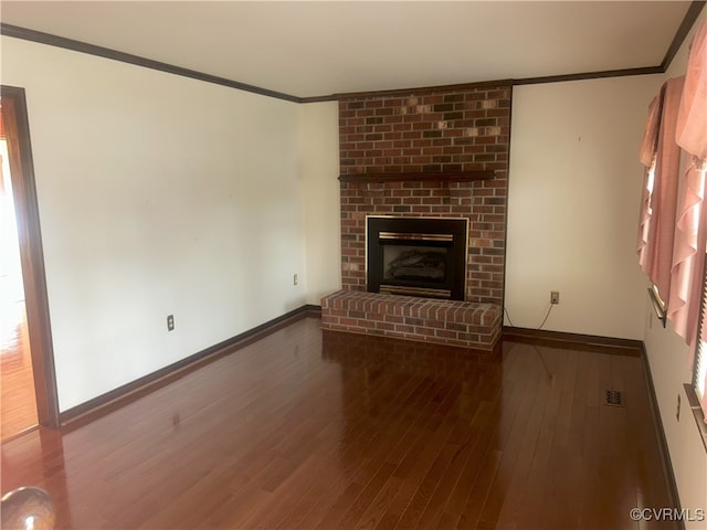 2611 Mistwood Forest Dr, Chester, VA 23831 - unfurnished living room with crown molding, baseboards, wood finished floors, and a fireplace