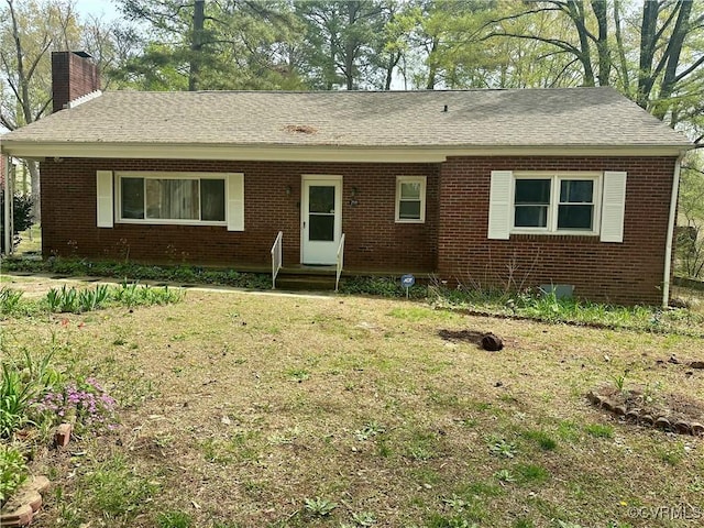 2919 Park Dr, Petersburg, VA 23805 - ranch-style house featuring a chimney, brick siding, a shingled roof, and a front yard