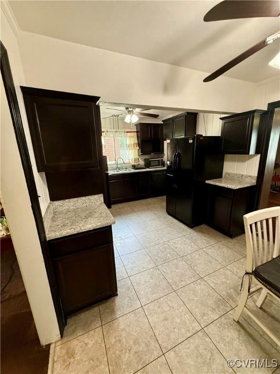 2919 Park Dr, Petersburg, VA 23805 - kitchen featuring freestanding refrigerator, a ceiling fan, light tile patterned floors, and stainless steel microwave