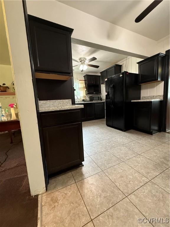 2919 Park Dr, Petersburg, VA 23805 - kitchen with ceiling fan, black refrigerator with ice dispenser, dark cabinets, and stainless steel microwave