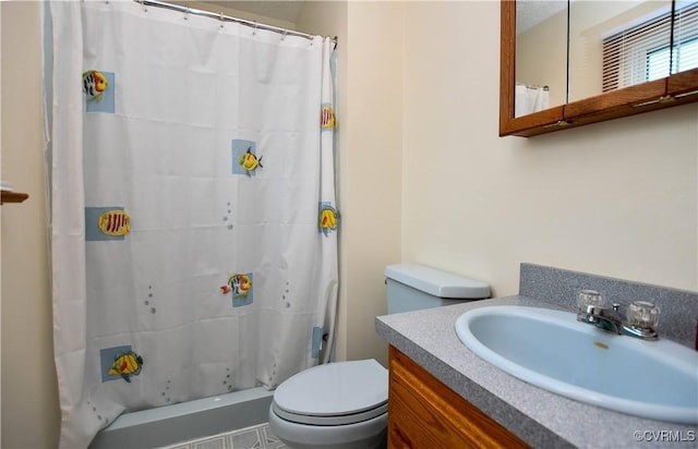 bathroom with toilet, vanity, and a shower with shower curtain