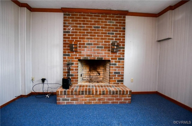 interior space with baseboards, a fireplace, and carpet