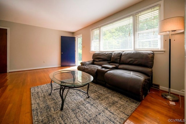 8186 Signal Hill Rd, Richmond, VA 23111 - living area featuring a wealth of natural light, wood finished floors, and baseboards