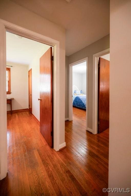 8186 Signal Hill Rd, Richmond, VA 23111 - hallway with wood finished floors and baseboards