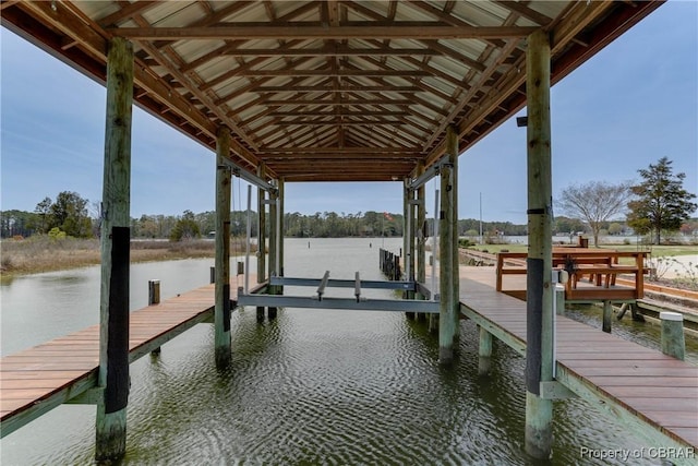 view of dock featuring boat lift and a water view