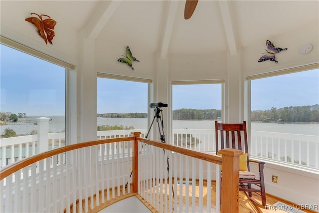 sunroom / solarium with a water view and a wealth of natural light
