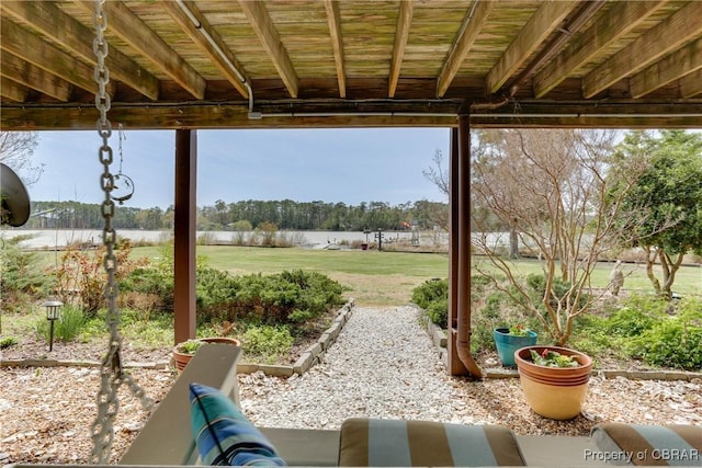 view of patio with a water view