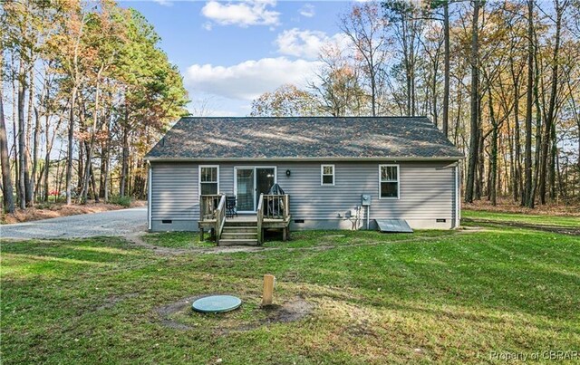 104 Martin Ln, Bohannon, VA 23021 - rear view of house with crawl space, roof with shingles, a wooden deck, and a lawn