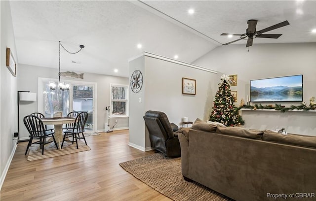 104 Martin Ln, Bohannon, VA 23021 - living room featuring ceiling fan with notable chandelier, light wood-type flooring, recessed lighting, lofted ceiling, and baseboards