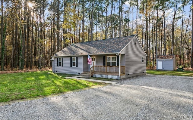 104 Martin Ln, Bohannon, VA 23021 - ranch-style house with crawl space, a front yard, an outbuilding, a shingled roof, and covered porch