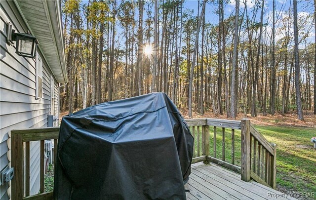 104 Martin Ln, Bohannon, VA 23021 - wooden terrace with a forest view, grilling area, and a yard