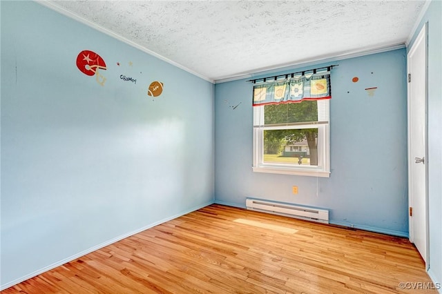 12161 Ashland Heights Rd, Ashland, VA 23005 - empty room featuring ornamental molding, a textured ceiling, baseboard heating, and wood finished floors